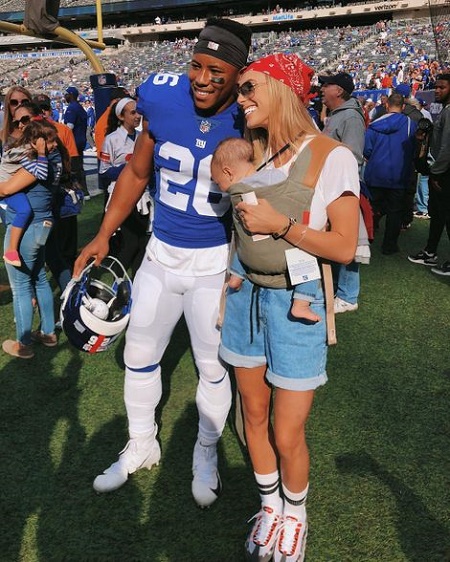 Jada Clare Barkley with her parents in MetLife Stadium